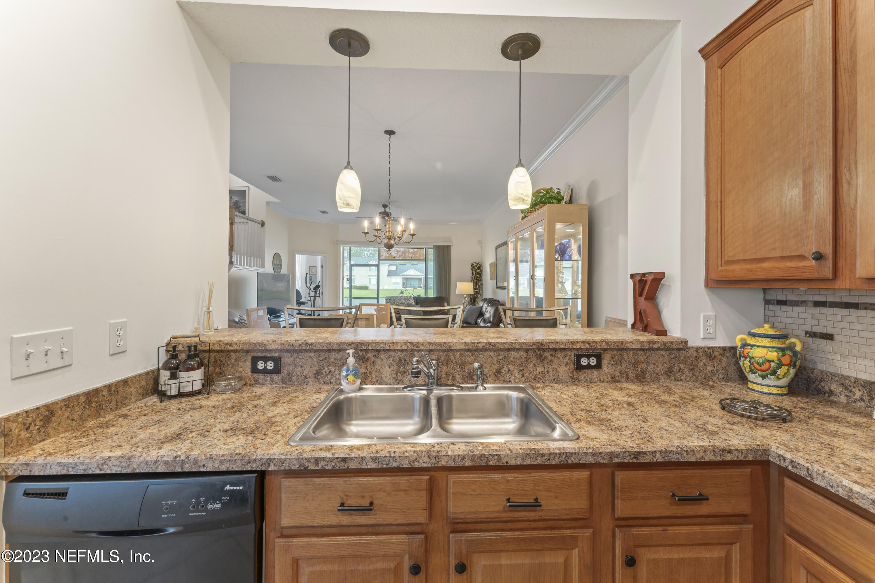 1840 Copper Stone Drive, Unit D Fleming Island, FL 32003 - Photo 12 of 66 a bathroom with a granite countertop sink and a window