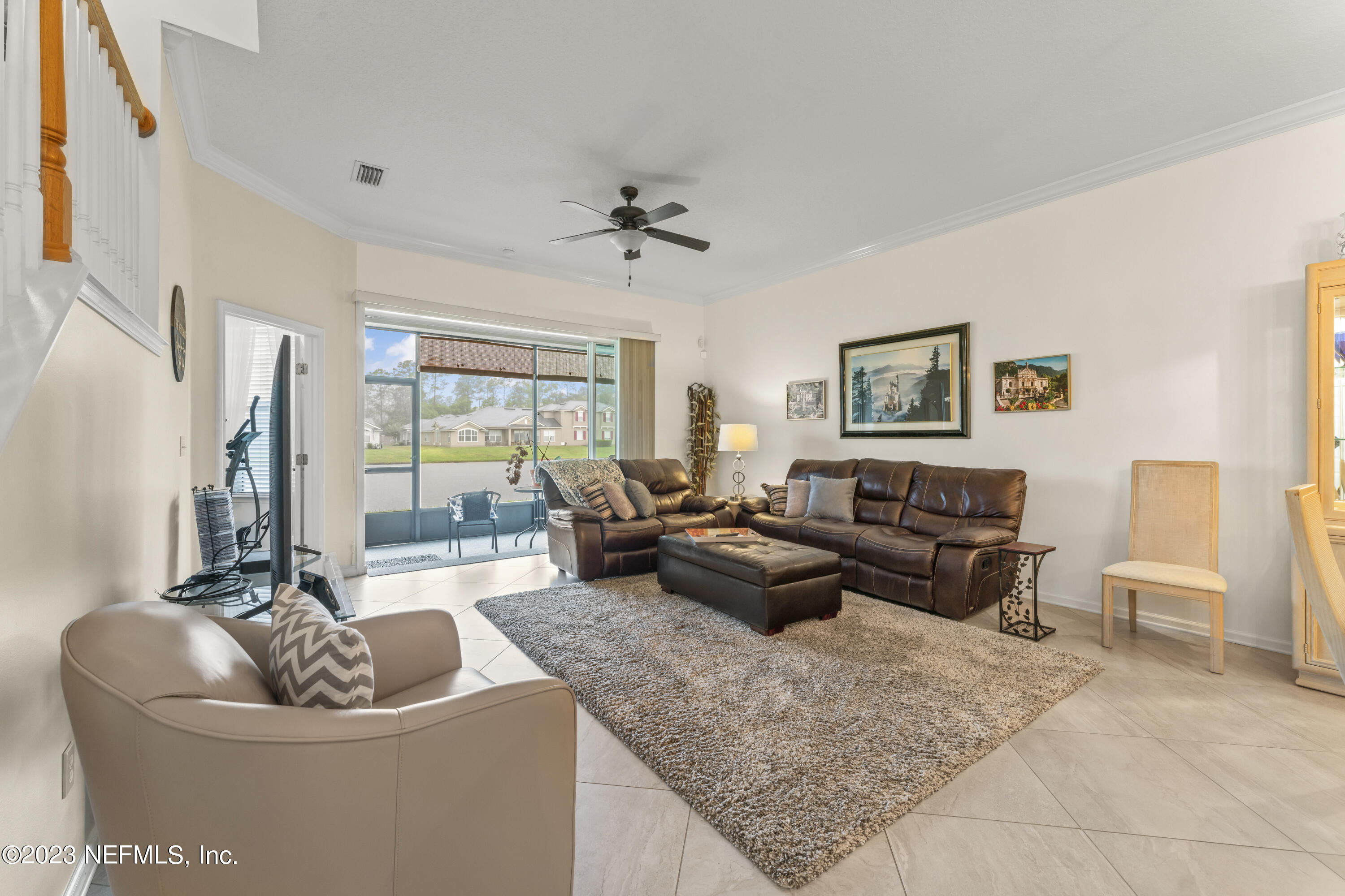 1840 Copper Stone Drive, Unit D Fleming Island, FL 32003 - Photo 2 of 66 a living room with furniture and a large window