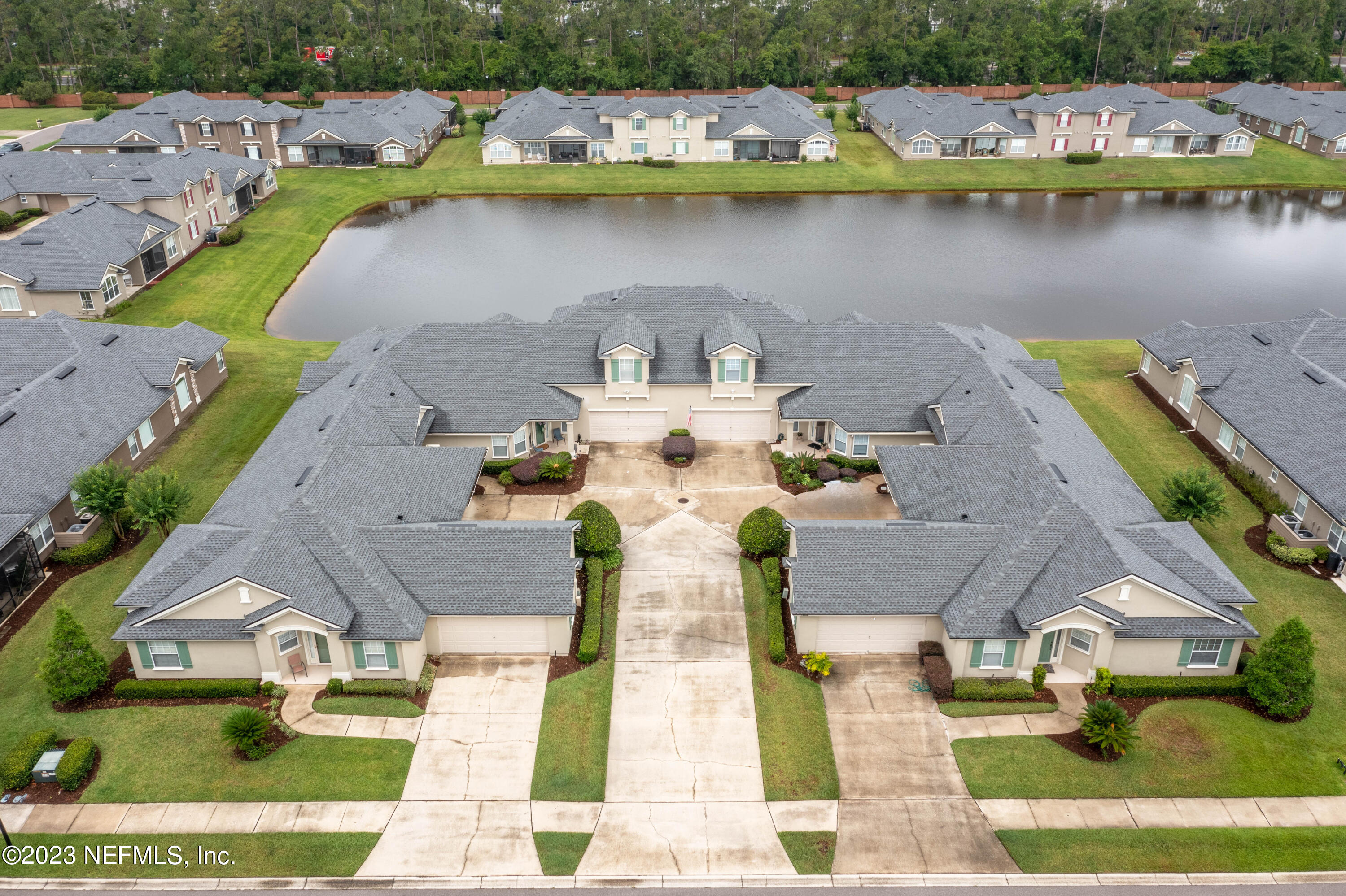 1840 Copper Stone Drive, Unit D Fleming Island, FL 32003 - Photo 32 of 66 an aerial view of a house with outdoor space lake view