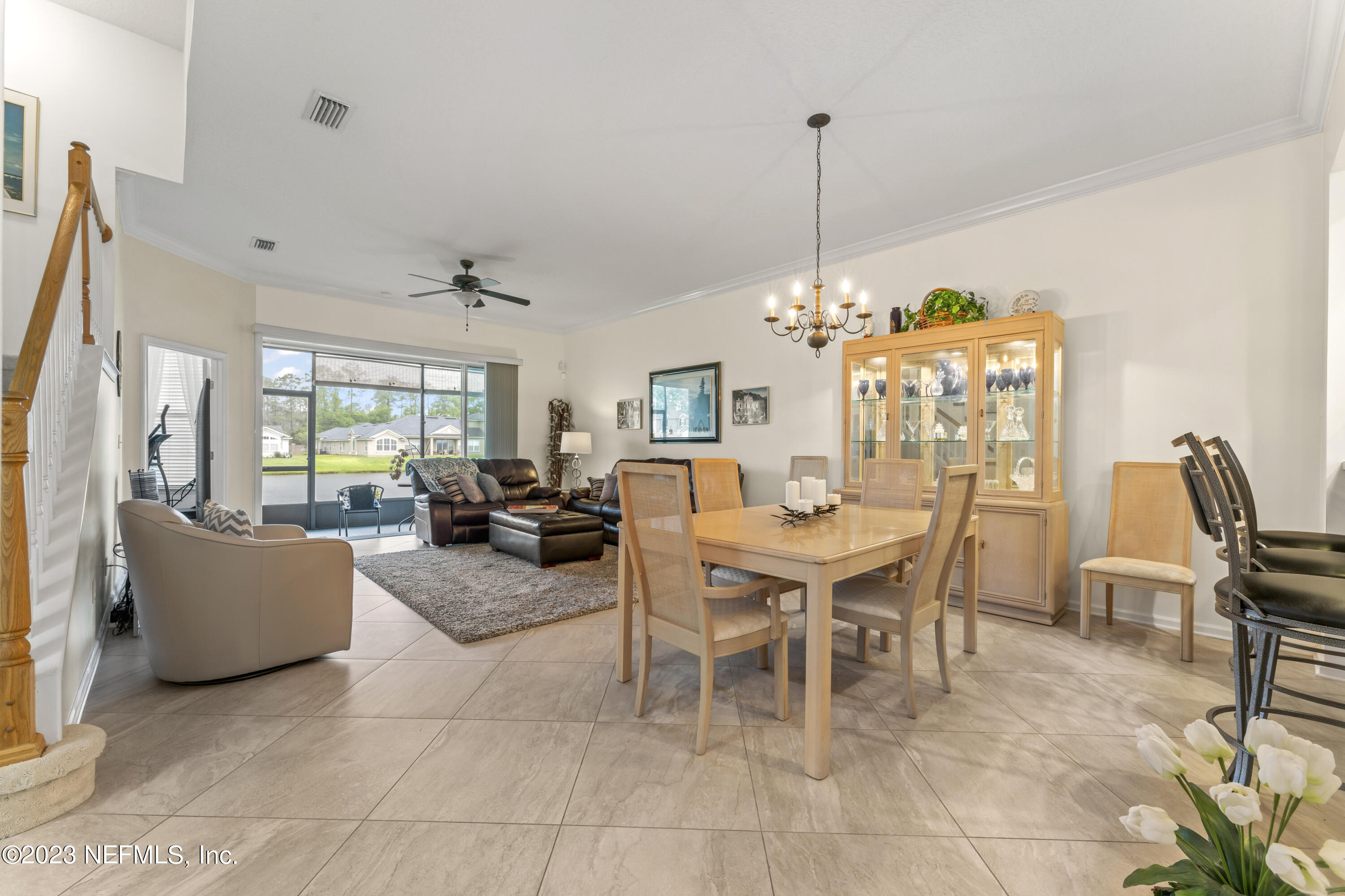 1840 Copper Stone Drive, Unit D Fleming Island, FL 32003 - Photo 4 of 66 a view of a dining room with furniture window and outside view