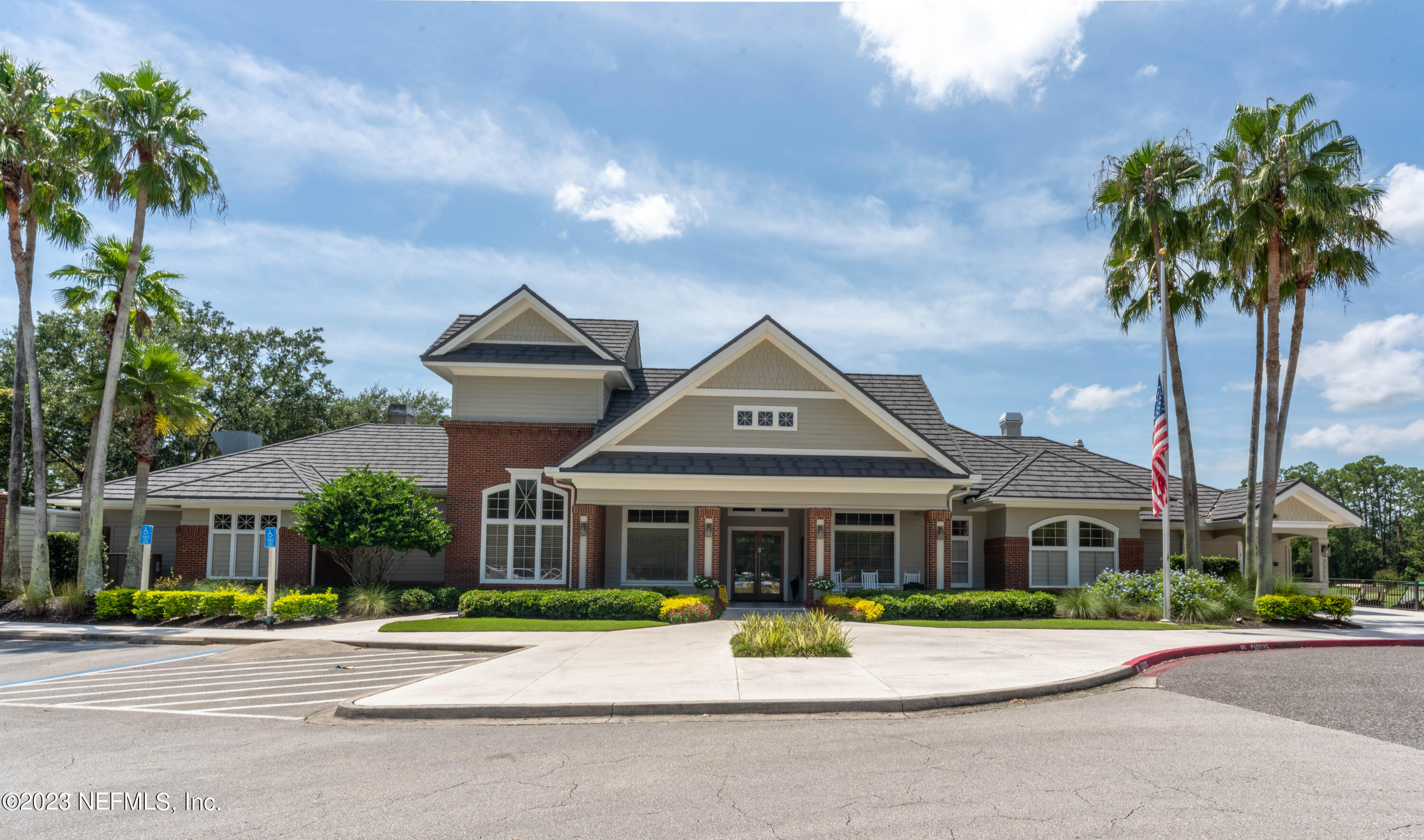1840 Copper Stone Drive, Unit D Fleming Island, FL 32003 - Photo 43 of 66 a front view of a house with a garden