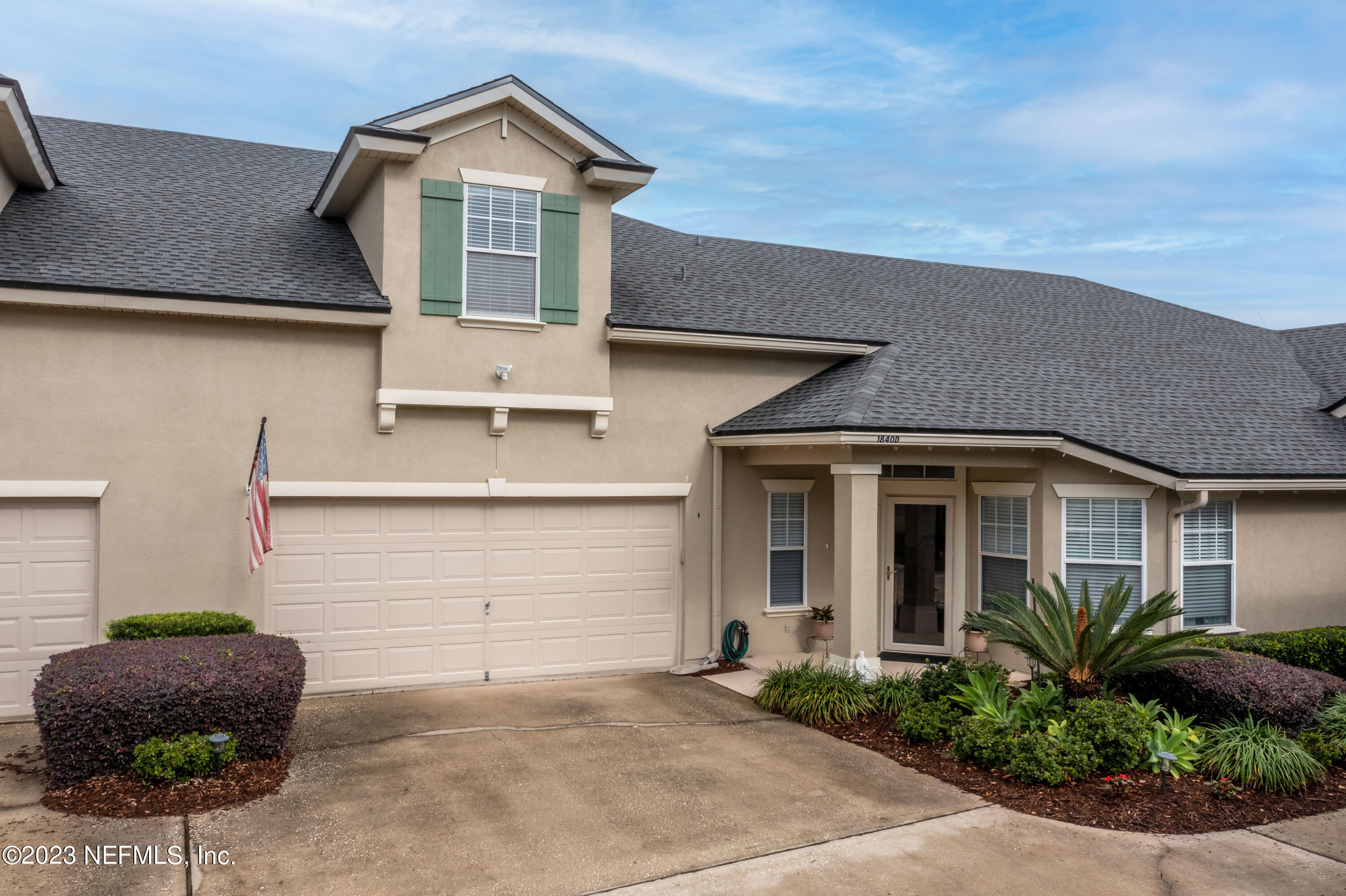 1840 Copper Stone Drive, Unit D Fleming Island, FL 32003 - Photo 51 of 66 a front view of a house with plants