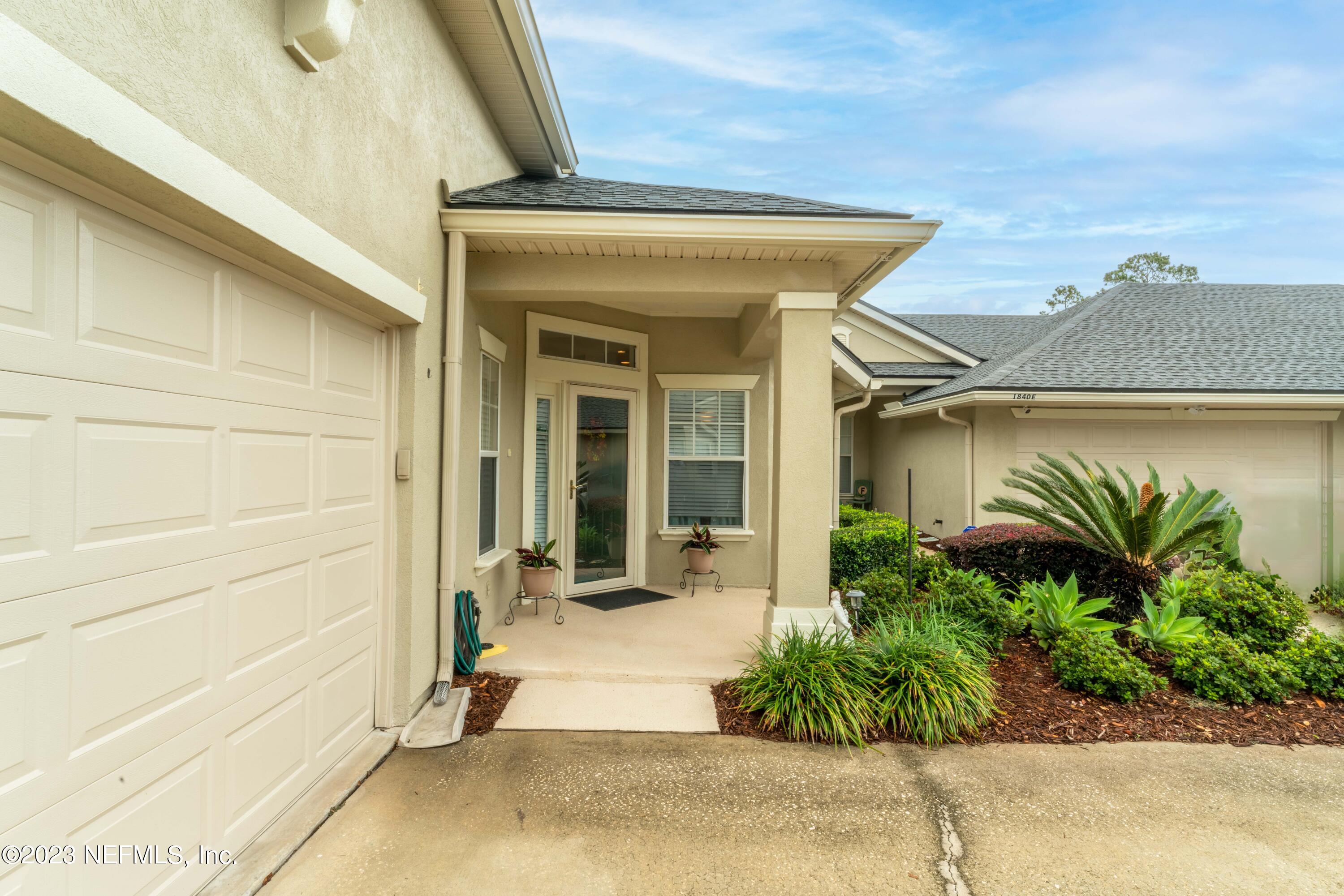 1840 Copper Stone Drive, Unit D Fleming Island, FL 32003 - Photo 55 of 66 a view of a entryway door front of house