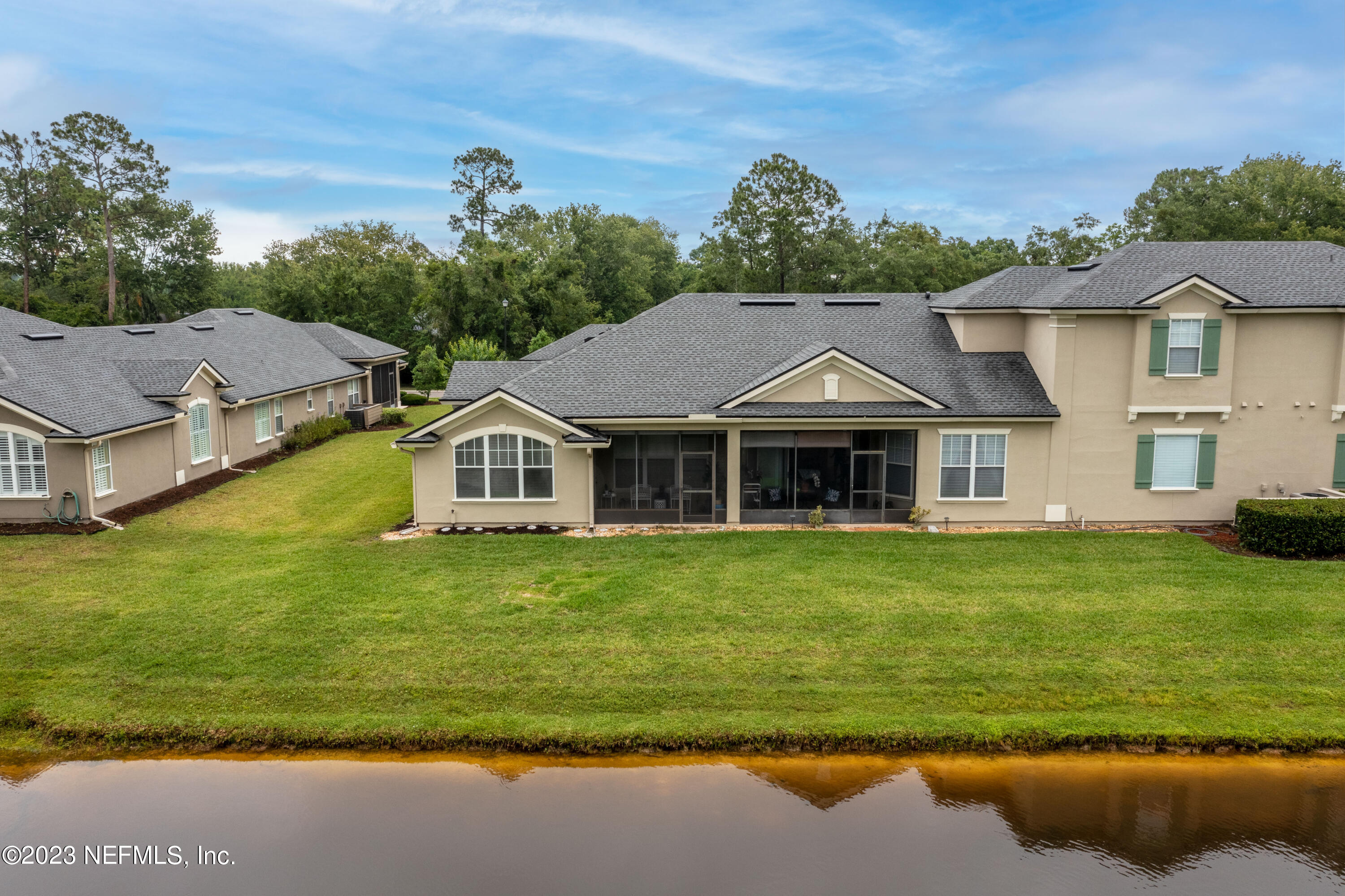 1840 Copper Stone Drive, Unit D Fleming Island, FL 32003 - Photo 61 of 66 a front view of a house with a garden