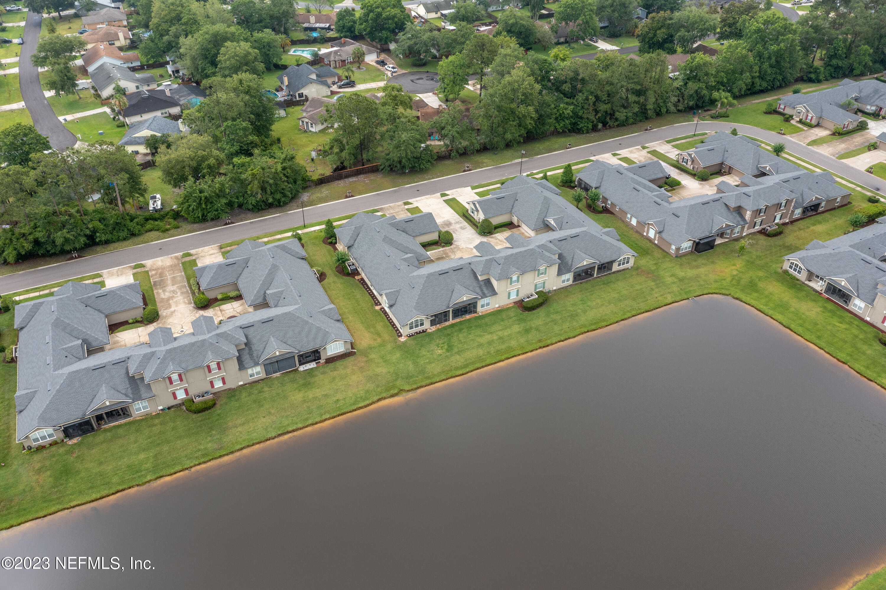 1840 Copper Stone Drive, Unit D Fleming Island, FL 32003 - Photo 63 of 66 an aerial view of a house with a garden