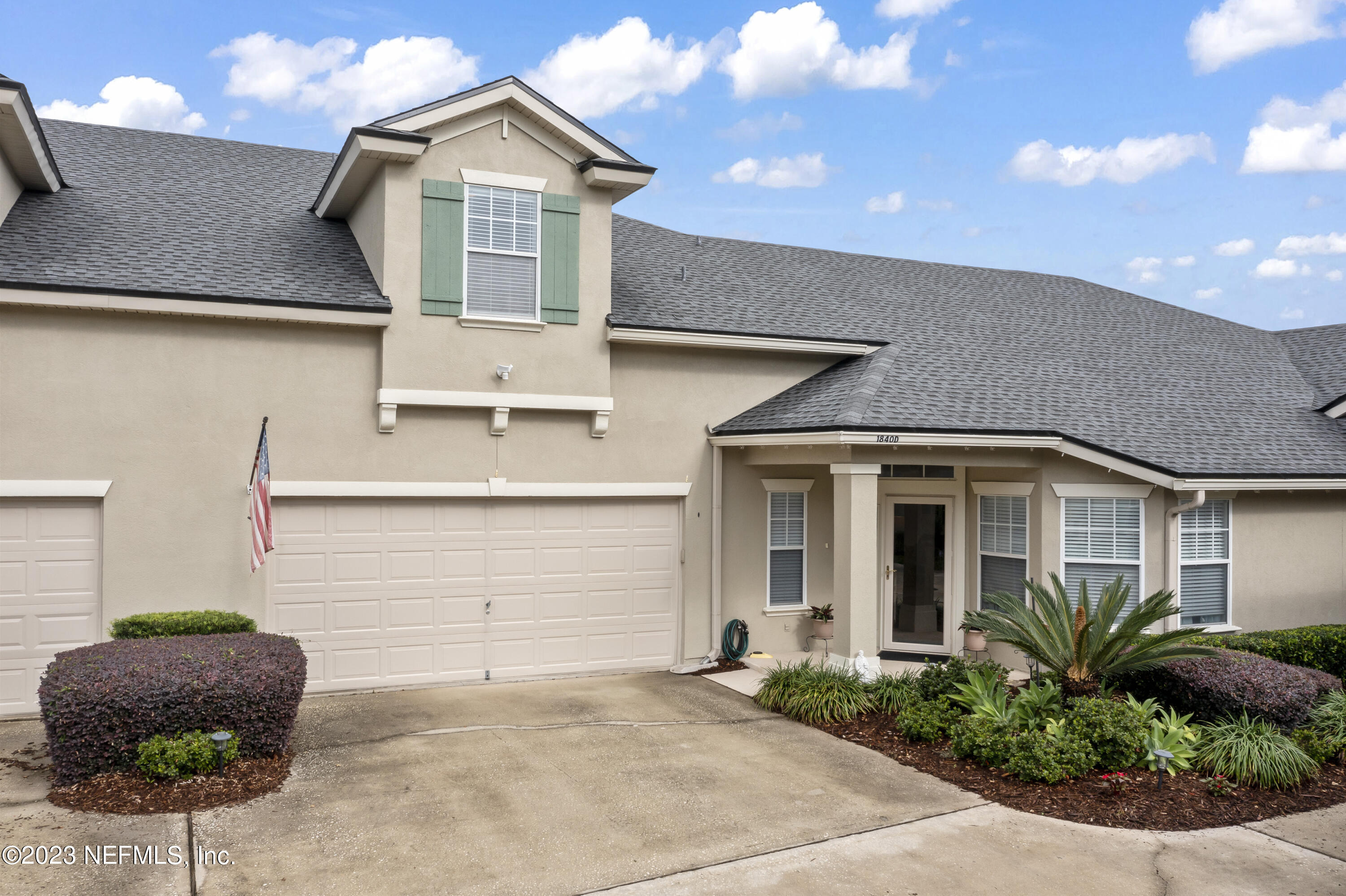 1840 Copper Stone Drive, Unit D Fleming Island, FL 32003 - Photo 66 of 66 a front view of a house with plants