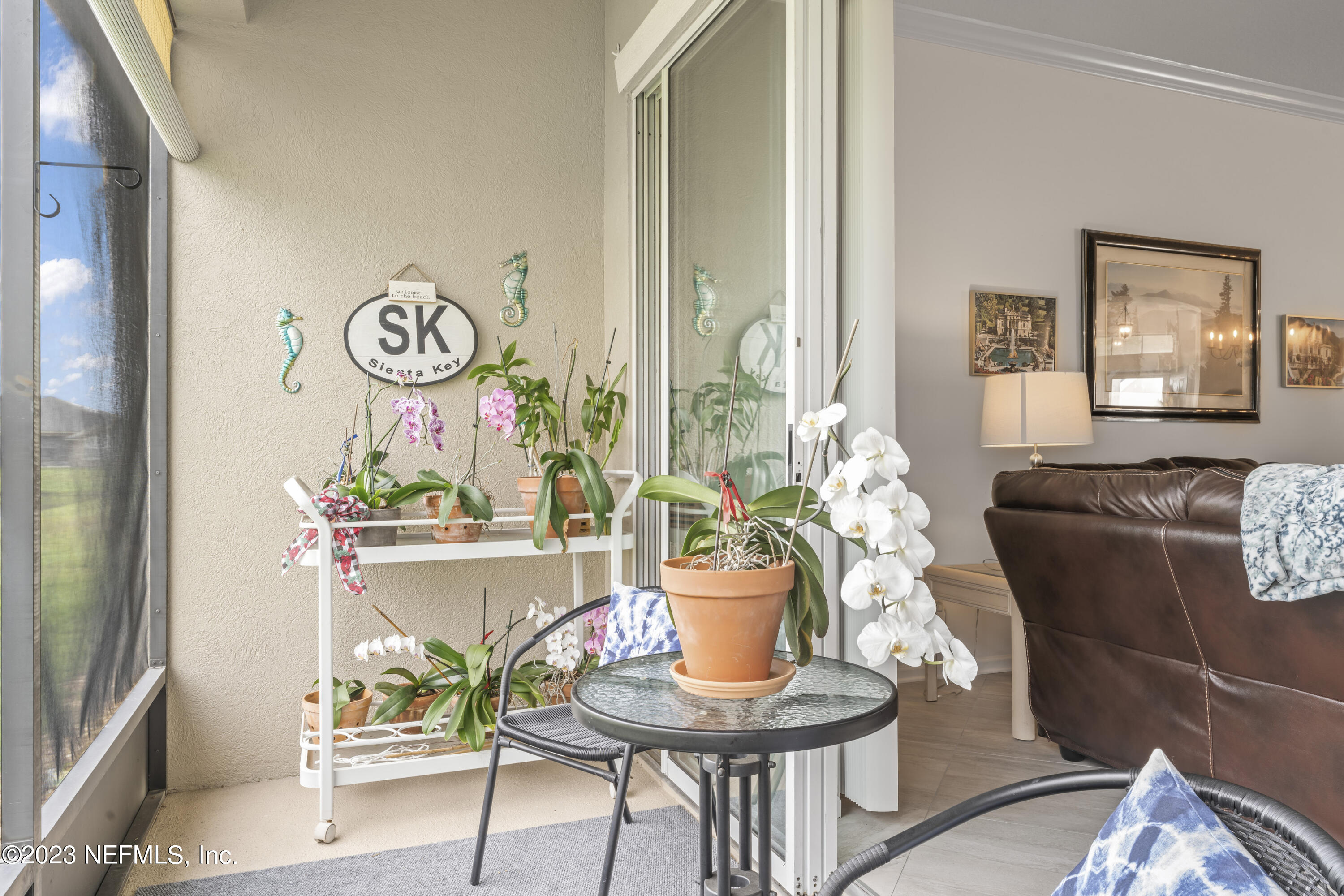 1840 Copper Stone Drive, Unit D Fleming Island, FL 32003 - Photo 8 of 66 a living room with furniture and a window