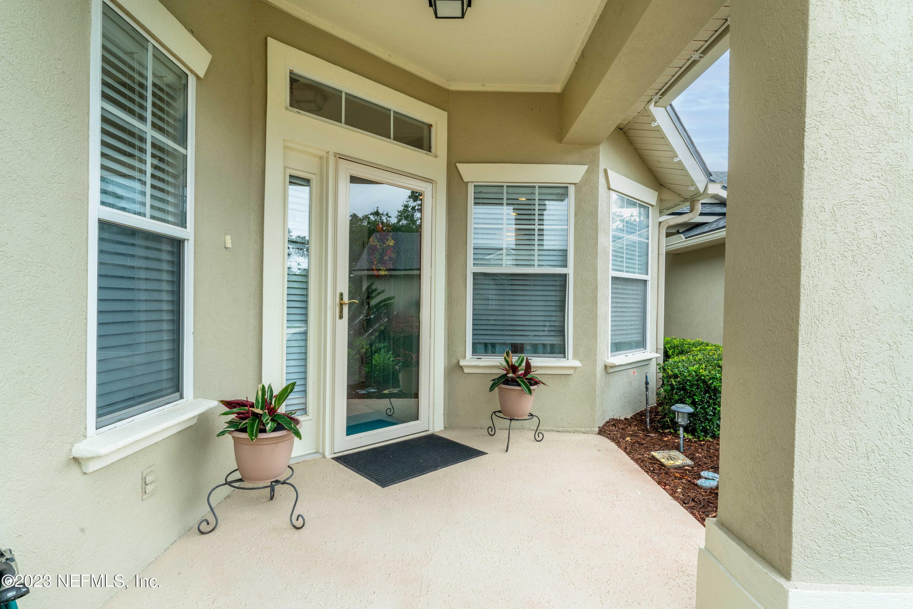1840 Copper Stone Drive, Unit D Fleming Island, FL 32003 - Photo 10 of 66 a bathroom with a tub and mirror