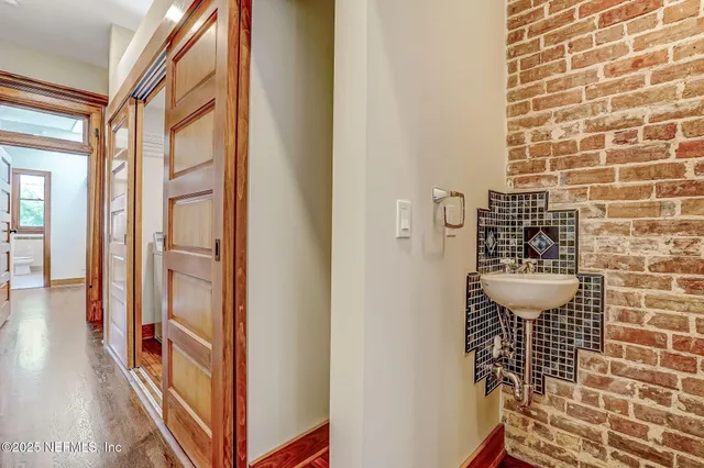 a bathroom with a shower and a sink