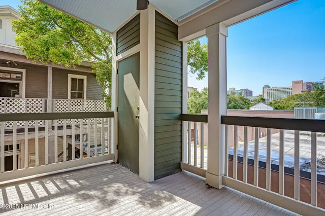 a view of a brick house with a large window
