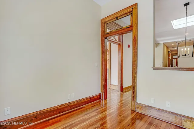 a view of an entryway with wooden floor