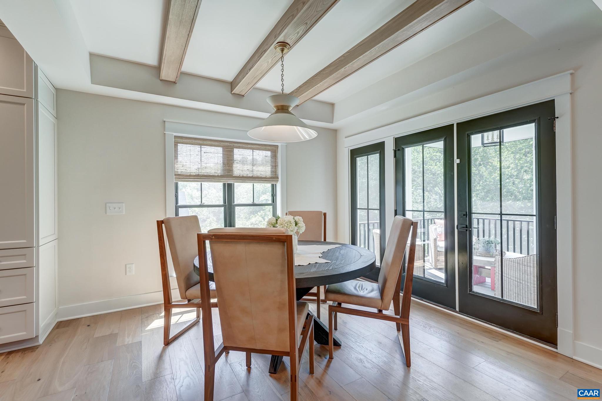 3327 Rowcross Street Crozet, VA 22932 - Photo 17 of 63 a view of a dining room with furniture and wooden floor