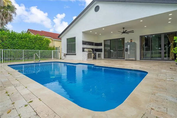 a view of swimming pool with outdoor seating