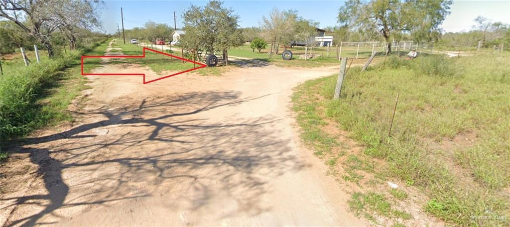 0 Riojas Road San Isidro, TX 78588 - Photo 14 of 16 a view of yard with swimming pool and trees