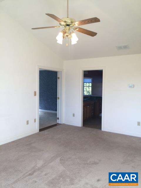 894 Graves Mill Road Madison, VA 22727 - Photo 13 of 40 an empty room with chandelier fan
