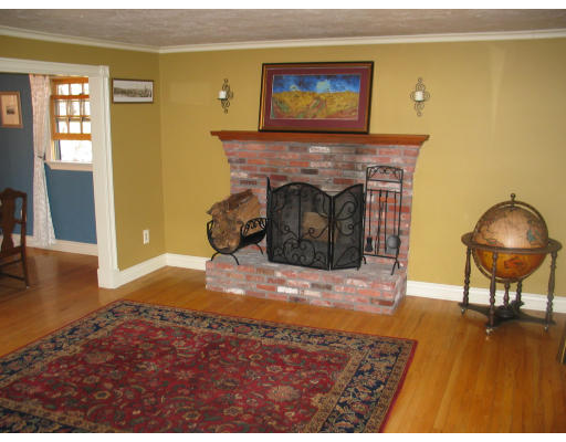 2191 Bay Road Sharon, MA 02067 - Photo 4 of 7 a living room with furniture and a fireplace
