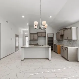 a view of a livingroom with a ceiling fan and window