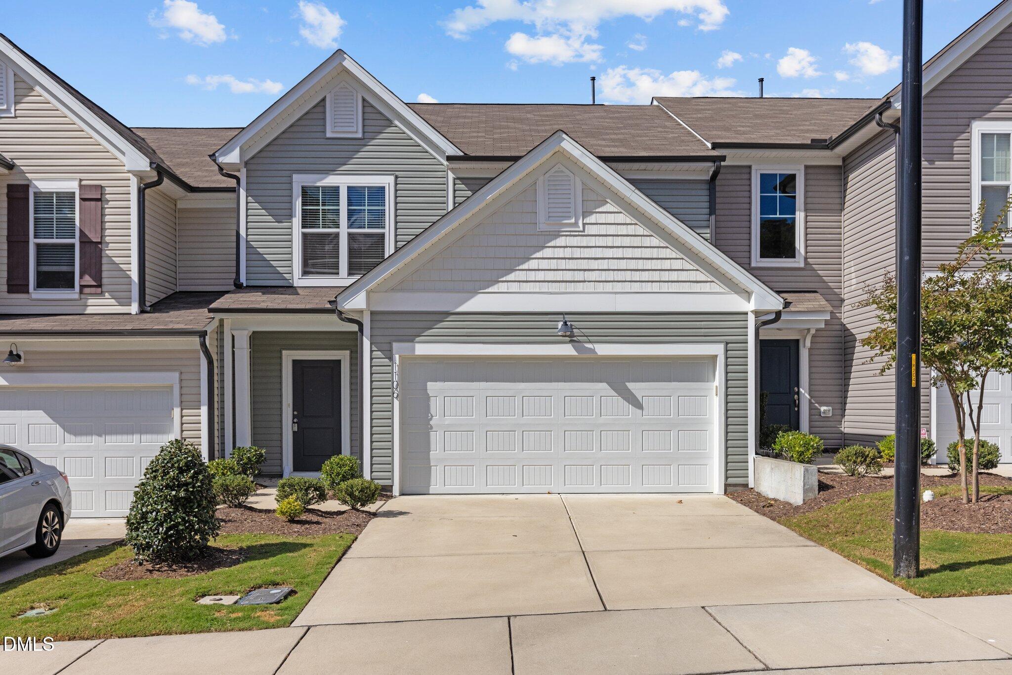 1106 Congleton Place Durham, NC 27703 - Photo 1 of 34 a front view of a house with garden