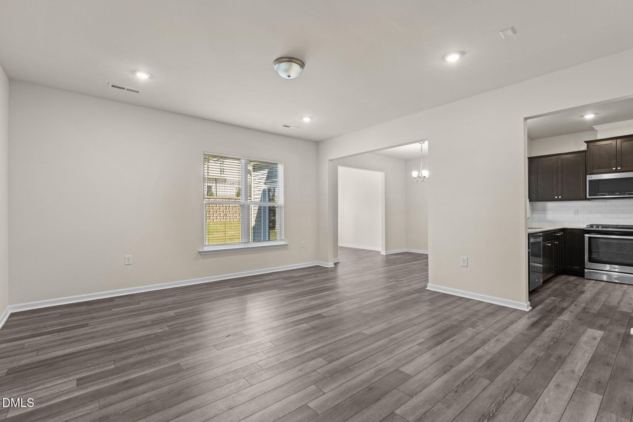 1106 Congleton Place Durham, NC 27703 - Photo 3 of 34 an empty room with wooden floor and windows