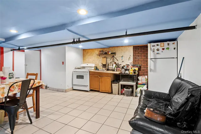 a kitchen with stainless steel appliances kitchen island granite countertop a sink and cabinets
