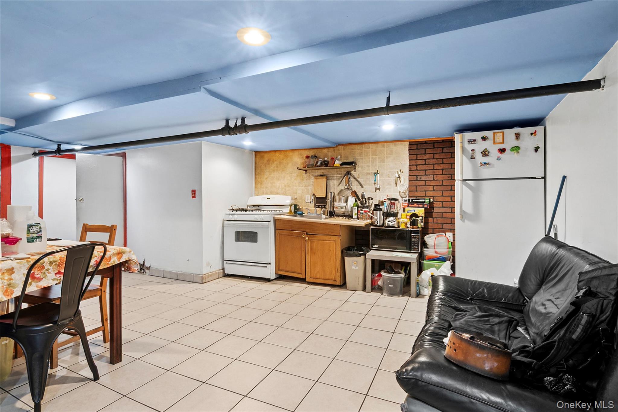 809 Friel Place Brooklyn, NY 11218 - Photo 11 of 19 a kitchen with stainless steel appliances kitchen island granite countertop a sink and cabinets