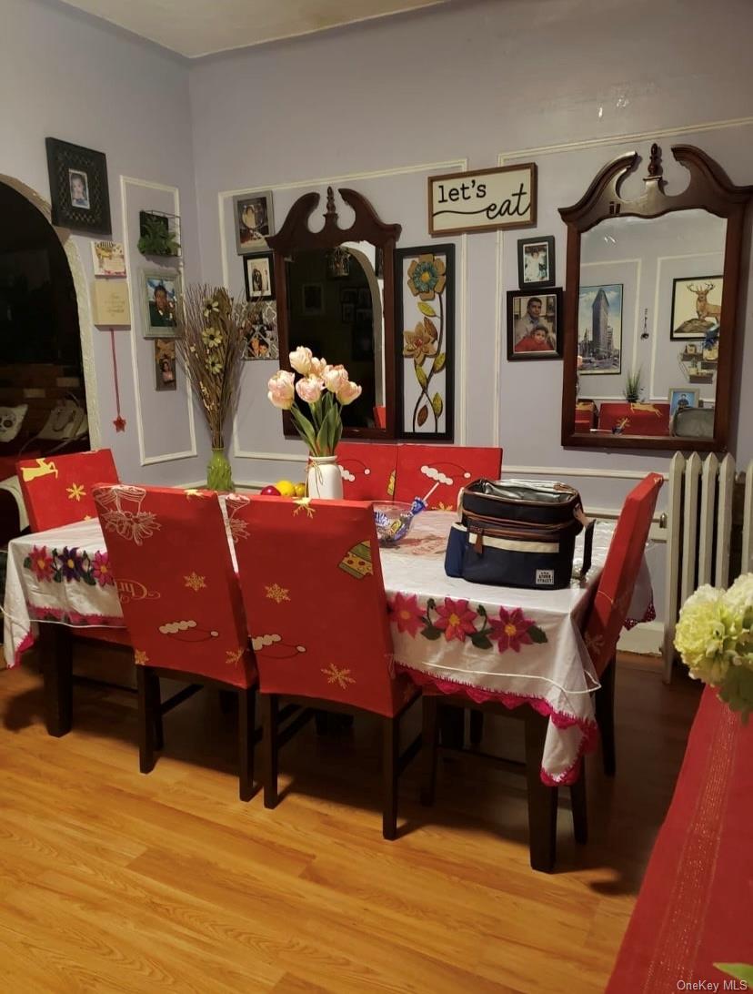 809 Friel Place Brooklyn, NY 11218 - Photo 16 of 19 a room with furniture and wooden floor