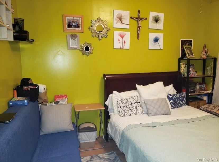 809 Friel Place Brooklyn, NY 11218 - Photo 18 of 19 a bed room with a bed and a couch