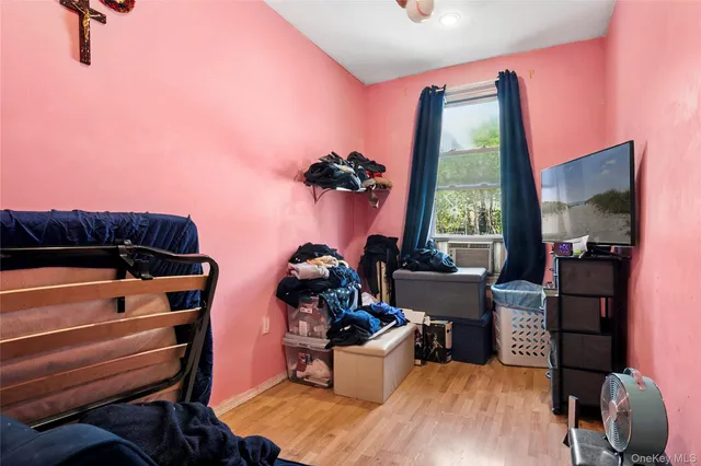 a bedroom with furniture and a window