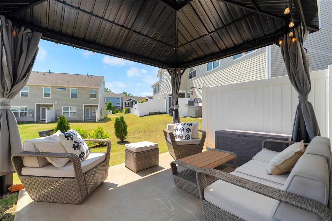 453 Bee Cv Way Pendleton, SC 29670 - Photo 10 of 25 A private western-facing outdoor space with a built-in gazebo creates a shaded patio perfect for enjoying Carolina sunsets.