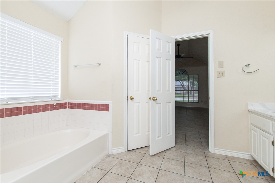 4713 Stagecoach Trail Temple, TX 76502 - Photo 14 of 23 a bathroom with a bathtub and shower