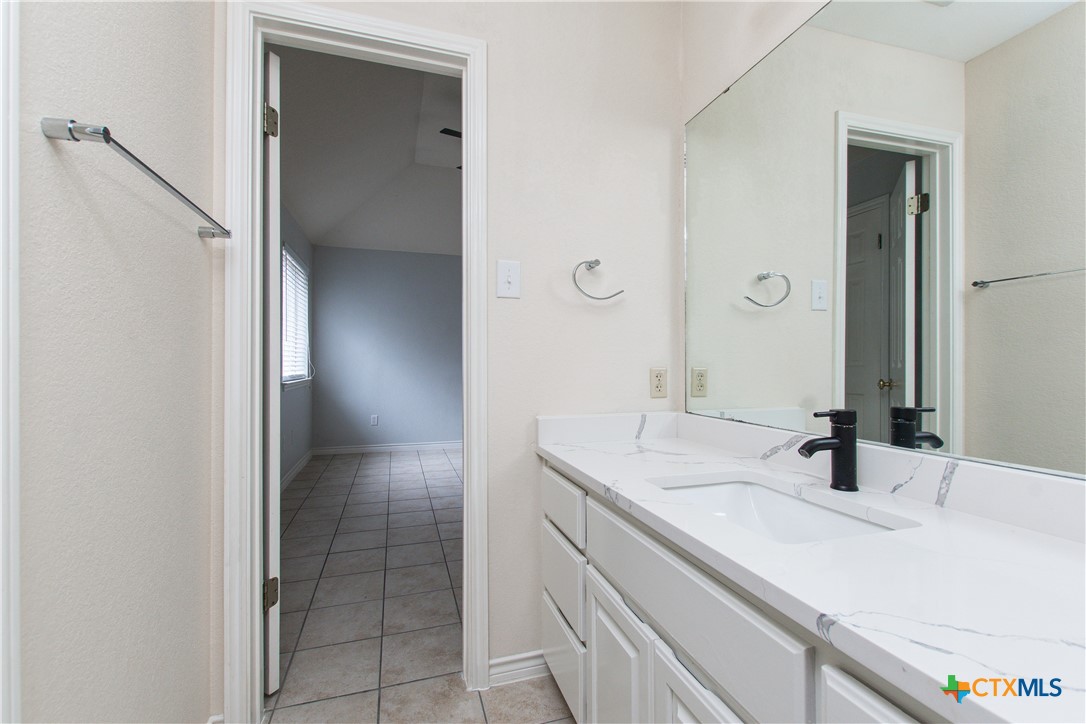 4713 Stagecoach Trail Temple, TX 76502 - Photo 19 of 23 a bathroom with a sink and a mirror
