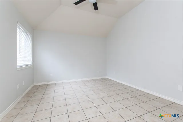 a view of an empty room and window