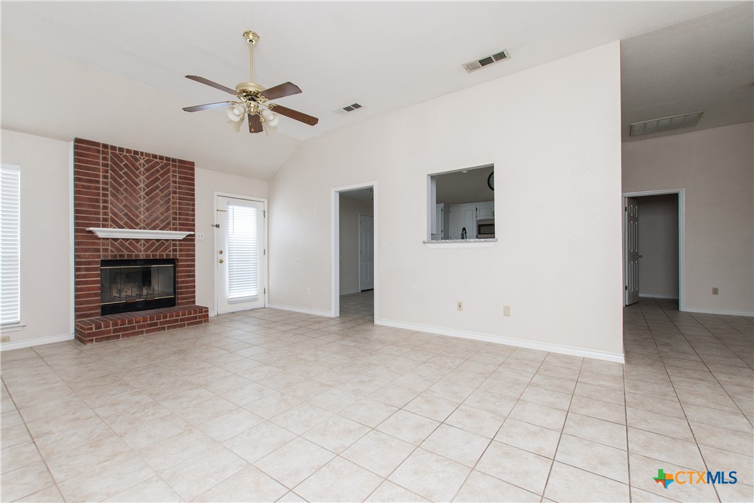 4713 Stagecoach Trail Temple, TX 76502 - Photo 3 of 23 an empty room with windows and fireplace