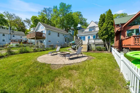 a view of a house with pool and a garden