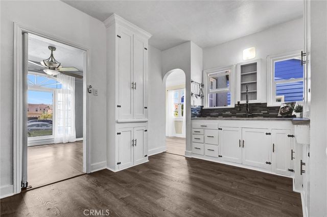 a view of cabinets and wooden floor