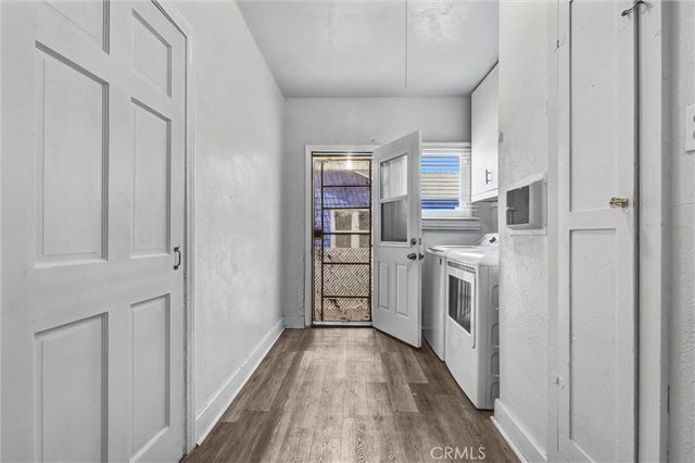 a view of a kitchen with electric appliances