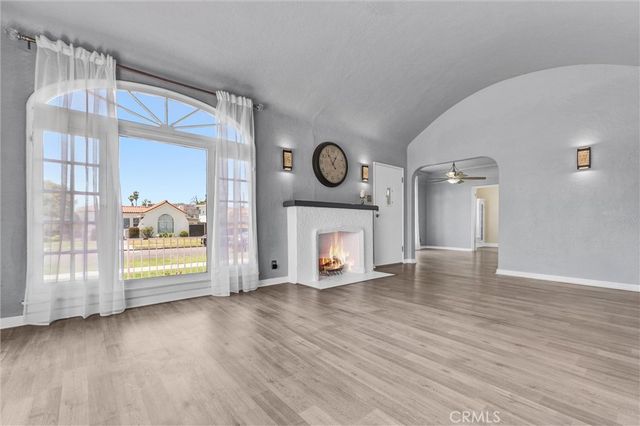 a view of a fireplace with wooden floor