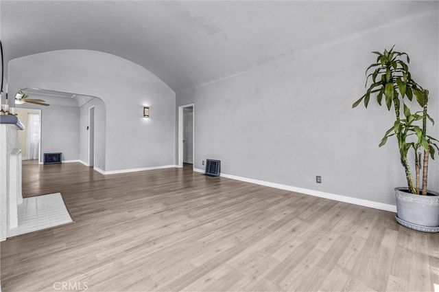 a view of a hallway with a potted plant