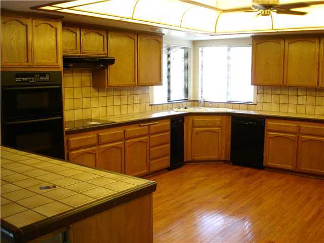 31133 Old River Road Bonsall, CA 92003 - Photo 8 of 18 Very large Kitchen, wood floors type unknown, Loads of storage space, New cook top to be installed. Great ceiling lighting, Ceiling Fan.