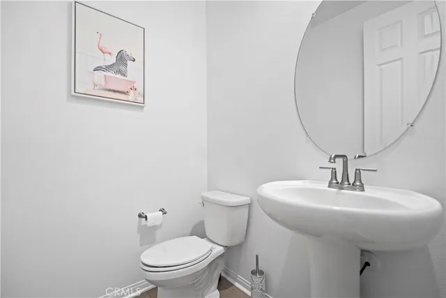 a bathroom with a toilet and a sink