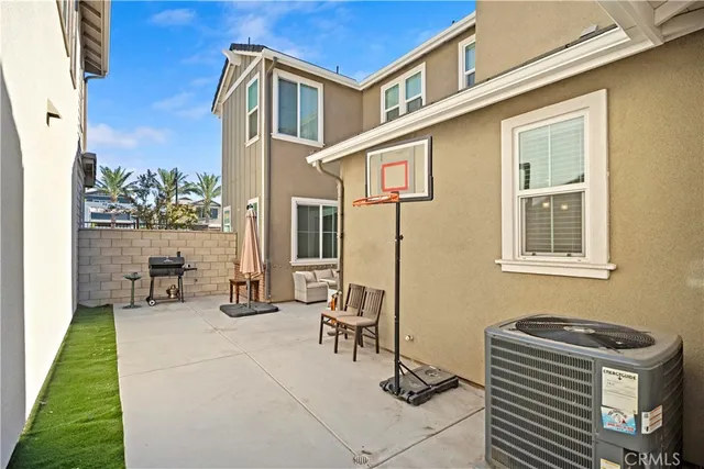 a view of a patio with a table and chairs
