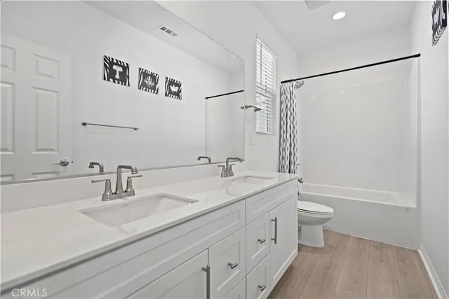 a utility room with sink dryer and washer