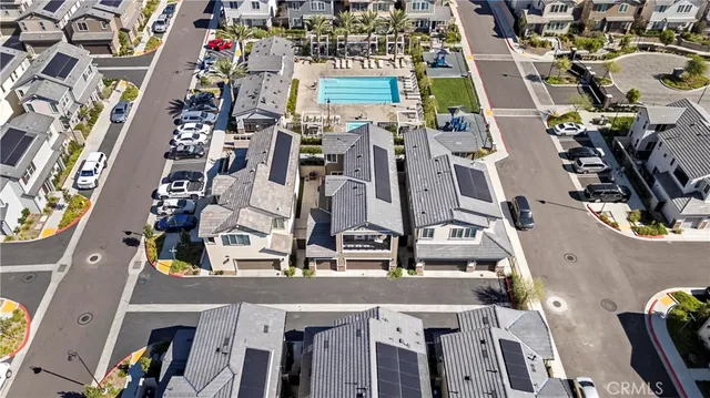 an aerial view of multi story residential apartment building with yard