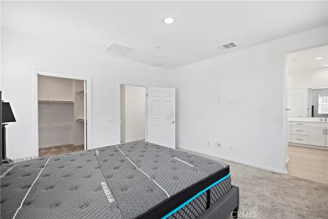 a spacious bathroom with sinks shower and a mirror