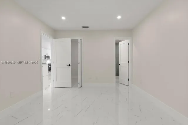 a bathroom with a sink toilet a mirror and shower