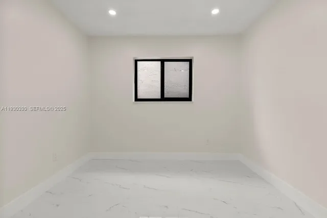 a view of a bathroom with a glass door