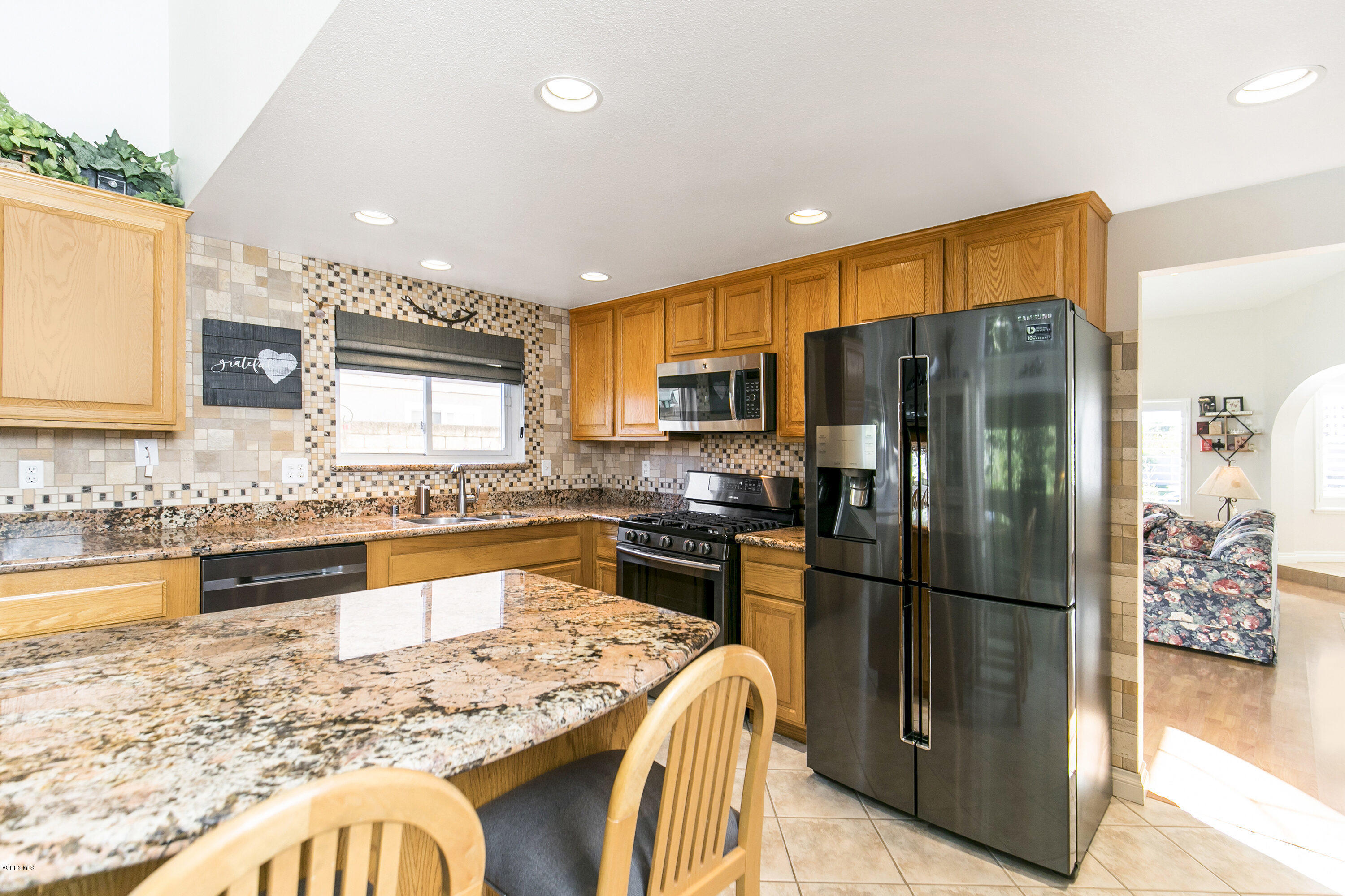 4722 Avedon Road Moorpark, CA 93021 - Photo 11 of 38 a kitchen with a refrigerator and a sink