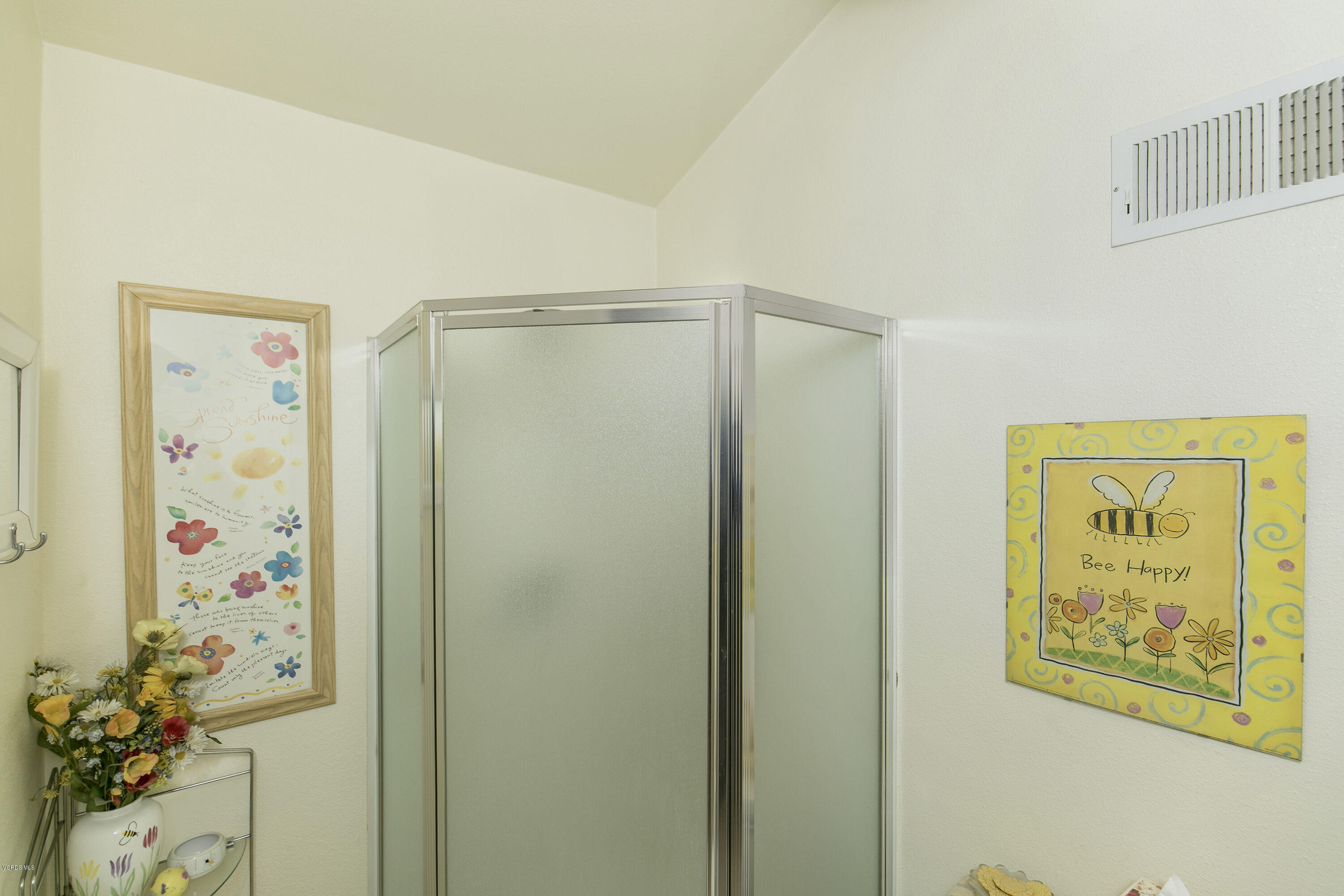 4722 Avedon Road Moorpark, CA 93021 - Photo 21 of 38 a bathroom with a shower curtain and a window