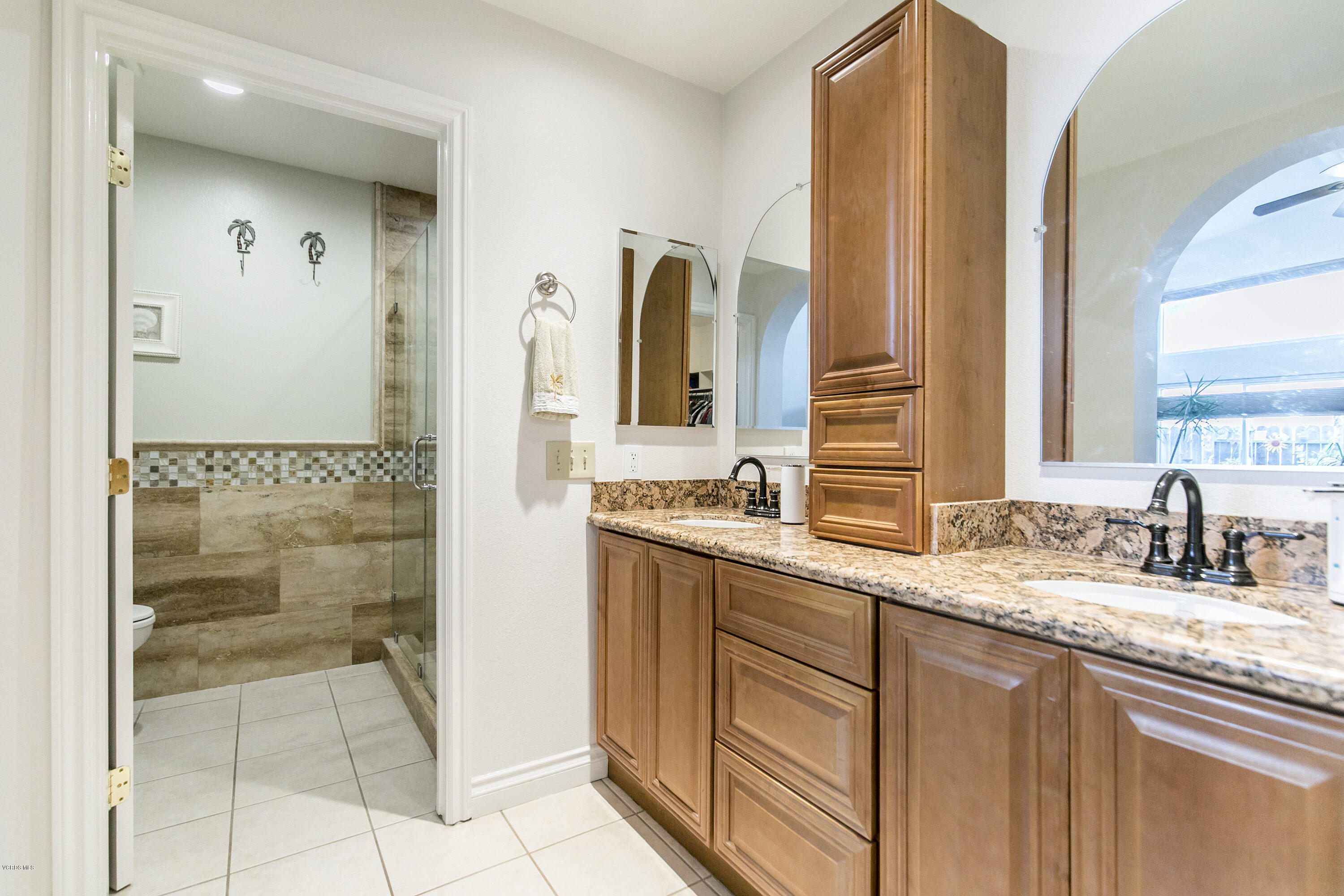 4722 Avedon Road Moorpark, CA 93021 - Photo 25 of 38 a bathroom with a granite countertop sink and a mirror