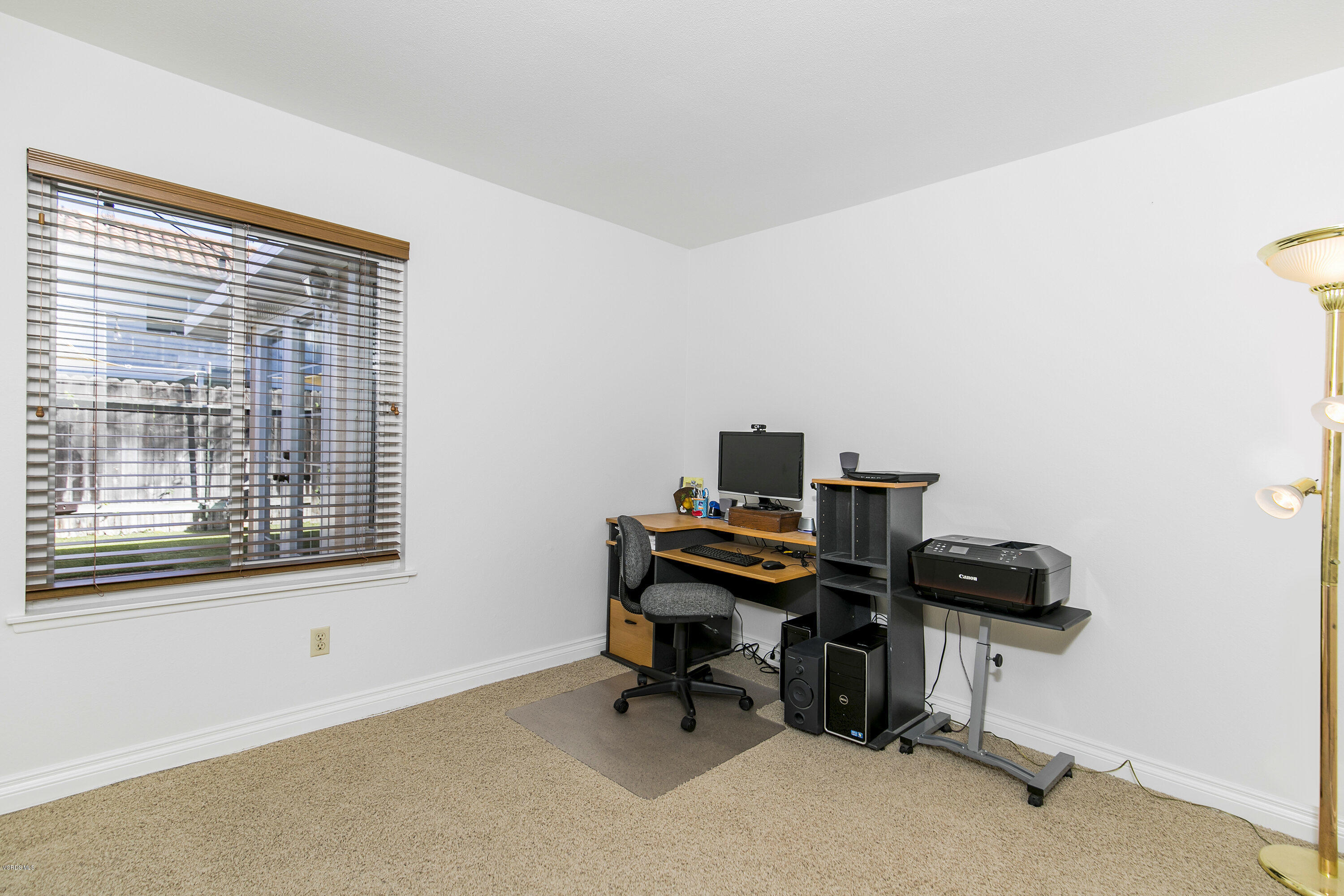 4722 Avedon Road Moorpark, CA 93021 - Photo 29 of 38 a view of a workspace with furniture and a window